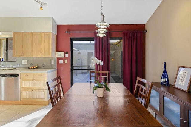 dining area featuring light tile patterned flooring