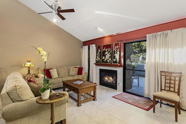 living room featuring ceiling fan and vaulted ceiling