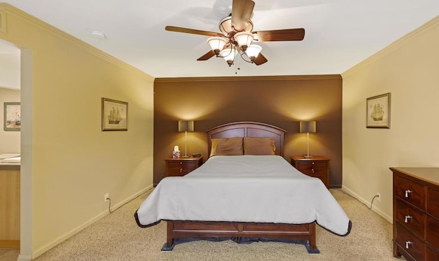 bedroom featuring light carpet, ceiling fan, and crown molding