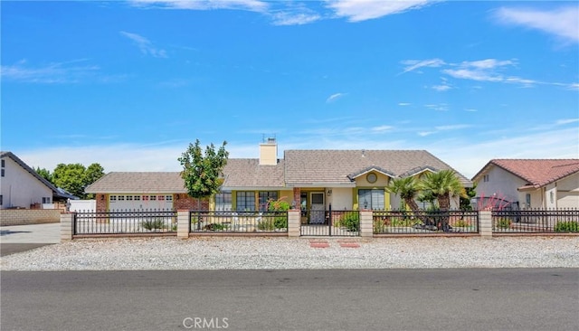 ranch-style home featuring a garage