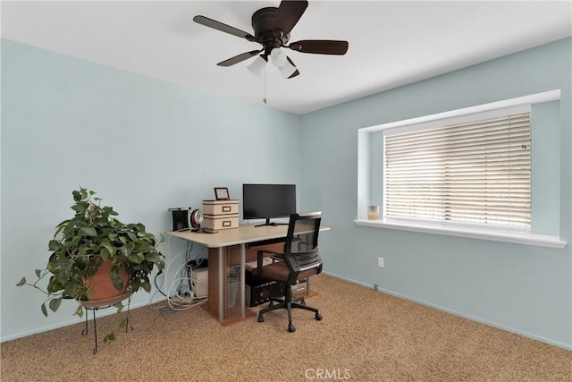 office area with ceiling fan and light carpet