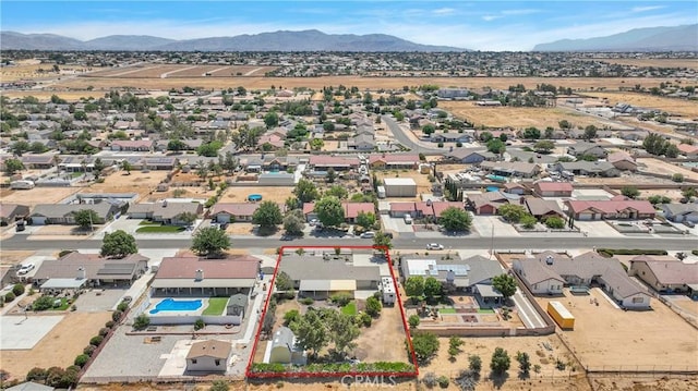 birds eye view of property featuring a mountain view