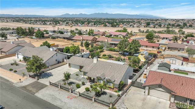 drone / aerial view featuring a mountain view