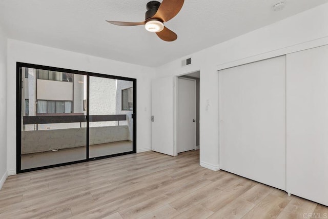 unfurnished bedroom featuring ceiling fan and light hardwood / wood-style flooring