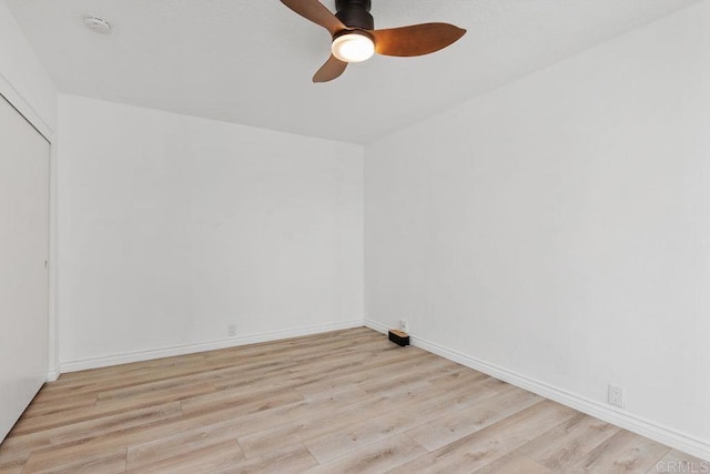 empty room with ceiling fan and light wood-type flooring