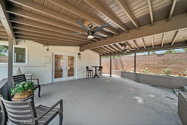 view of patio featuring ceiling fan and french doors