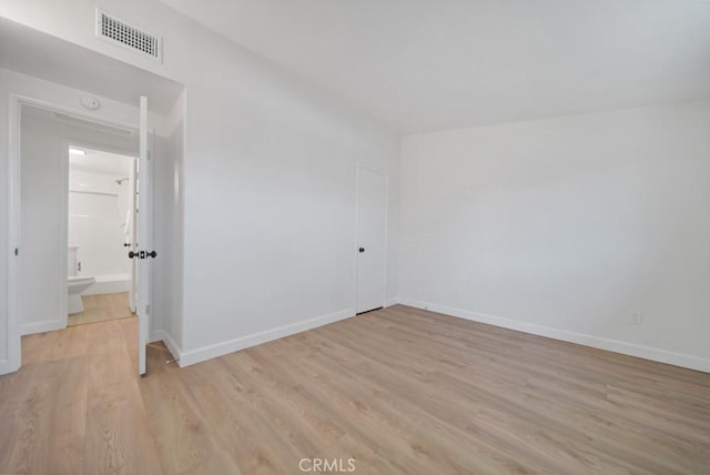 unfurnished room featuring light hardwood / wood-style flooring