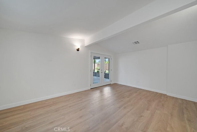 unfurnished room with light wood-type flooring, vaulted ceiling with beams, and french doors