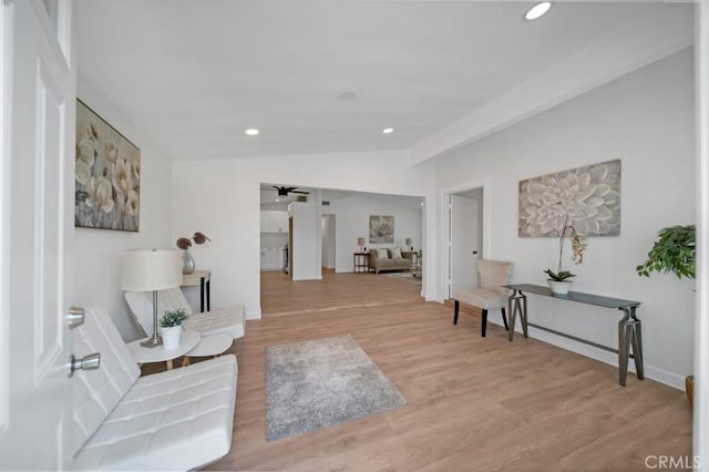 interior space featuring vaulted ceiling and light hardwood / wood-style flooring