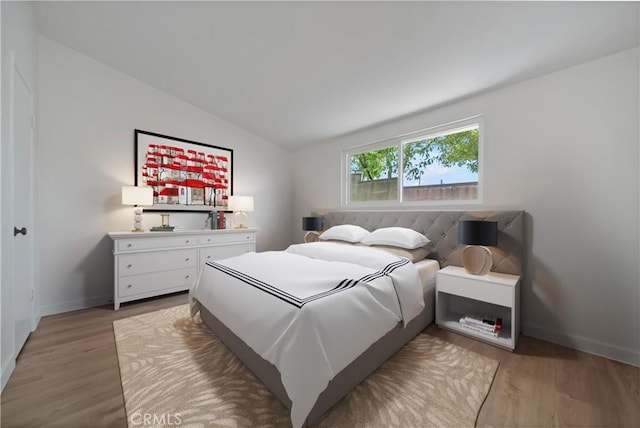 bedroom featuring hardwood / wood-style flooring