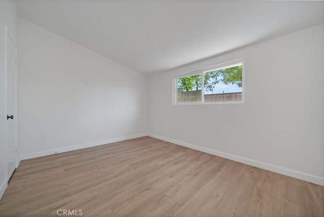 spare room with light wood-type flooring