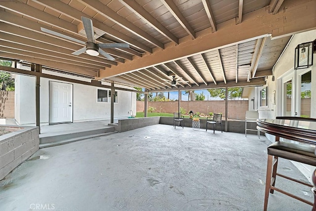 view of patio featuring ceiling fan