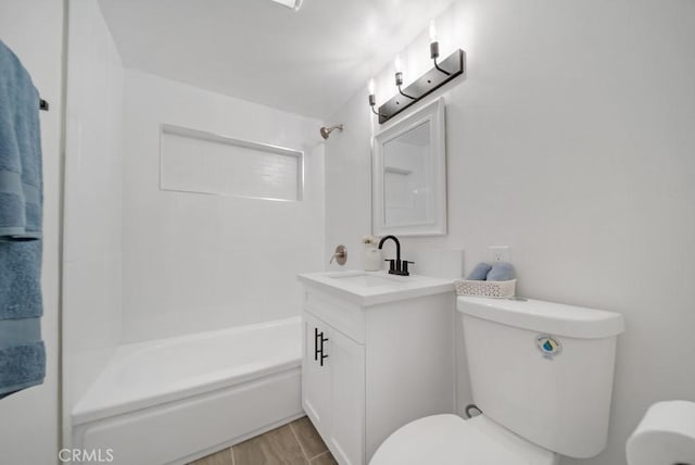 full bathroom featuring toilet, vanity, and bathing tub / shower combination