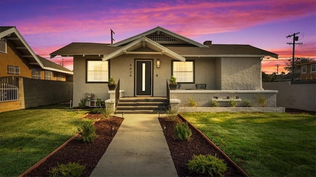 view of front of house with a yard