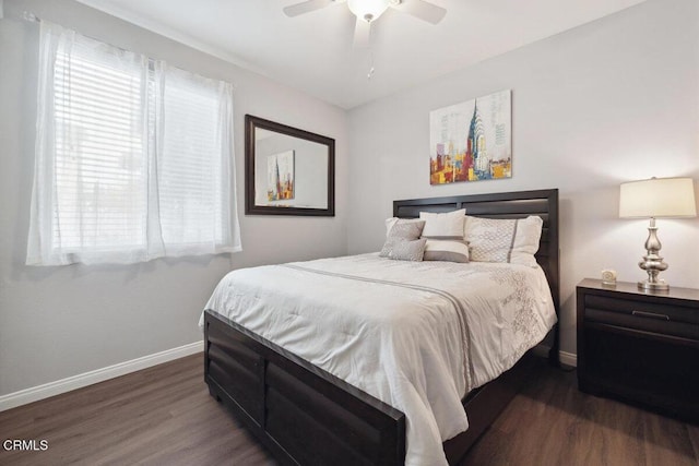 bedroom featuring ceiling fan and dark hardwood / wood-style flooring