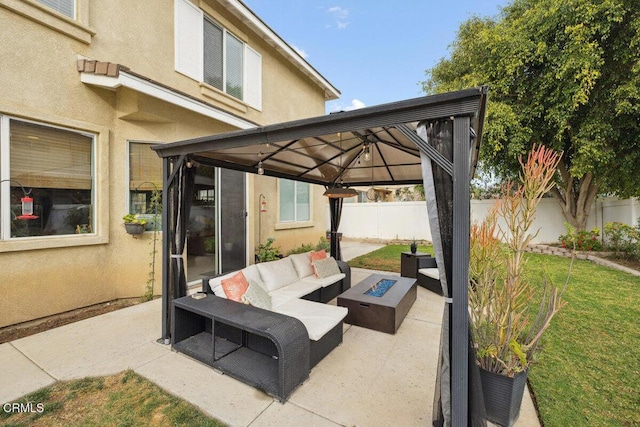 view of patio / terrace with an outdoor living space with a fire pit and a gazebo