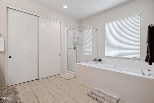 bathroom featuring tile patterned floors and walk in shower