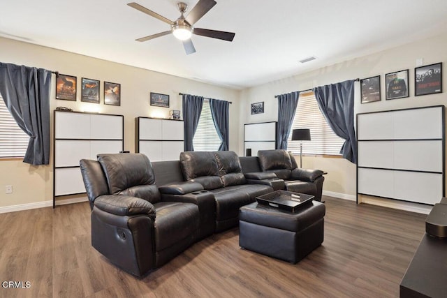 home theater featuring ceiling fan and wood-type flooring