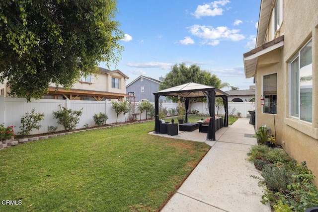 view of yard with an outdoor living space, a patio area, and a gazebo