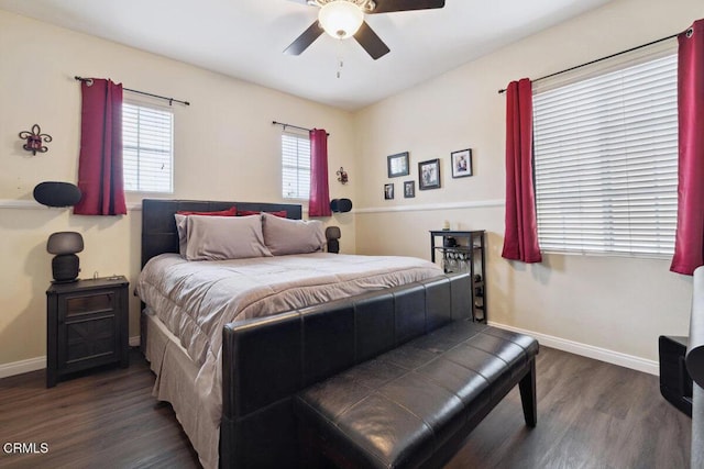 bedroom with ceiling fan and dark hardwood / wood-style floors