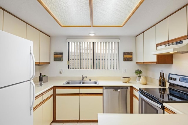 kitchen featuring light tile patterned floors, appliances with stainless steel finishes, white cabinets, and sink