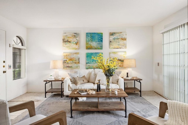 sitting room featuring light colored carpet