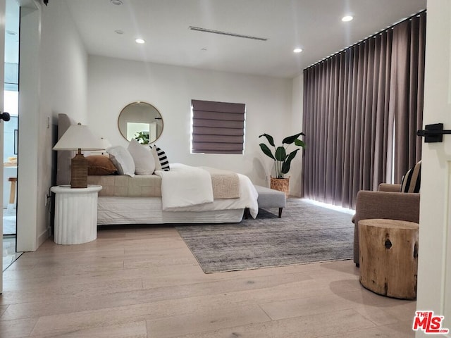 bedroom featuring light wood-type flooring