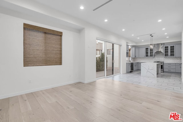 unfurnished living room featuring light wood-type flooring