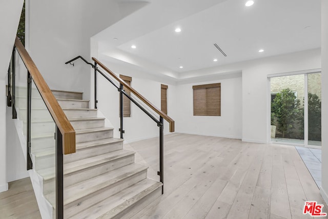 stairs with wood-type flooring