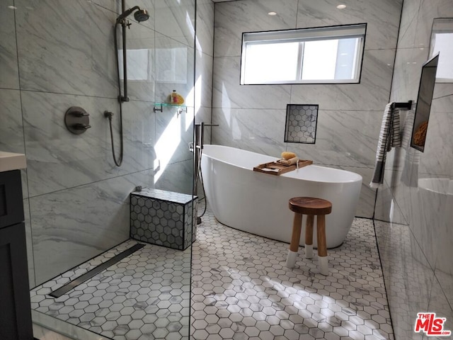 bathroom featuring a bath and tile patterned flooring