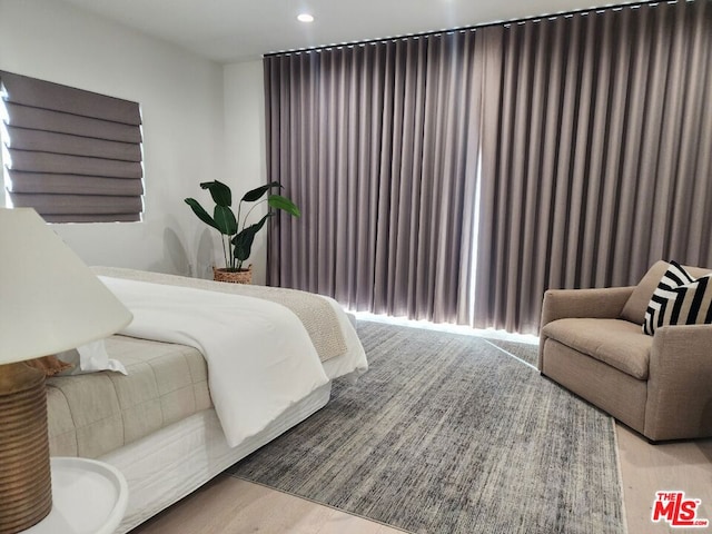 bedroom with light hardwood / wood-style flooring