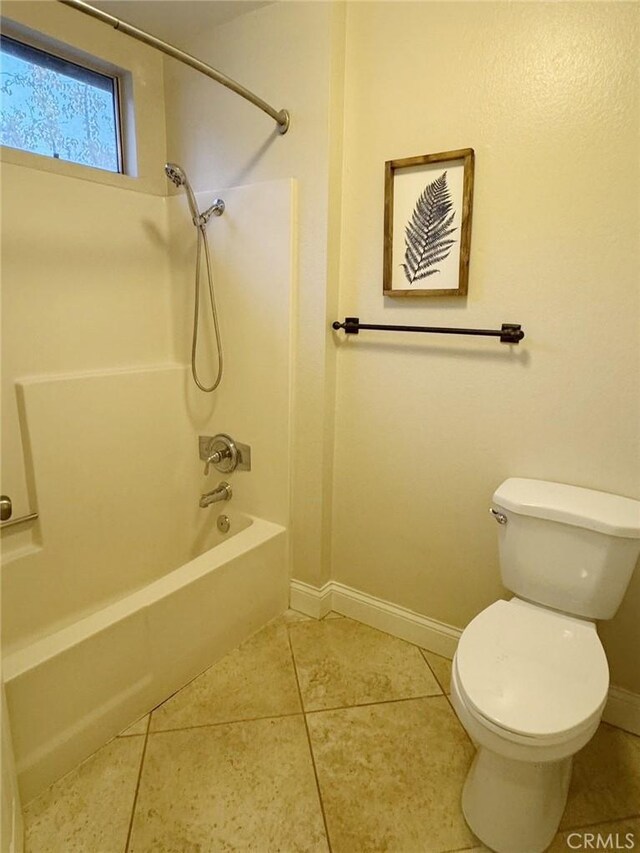 bathroom featuring toilet, shower / bathtub combination, and tile patterned flooring