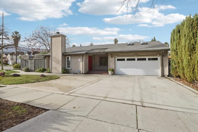 ranch-style house featuring a garage