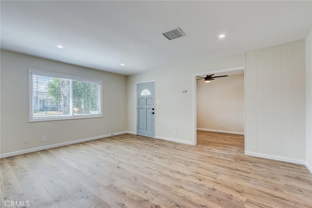 foyer entrance featuring ceiling fan and light wood-type flooring