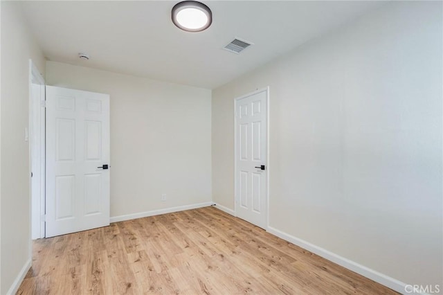 unfurnished room featuring light hardwood / wood-style flooring