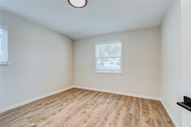 spare room with light wood-type flooring