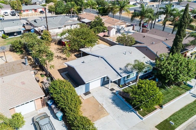 birds eye view of property with a residential view