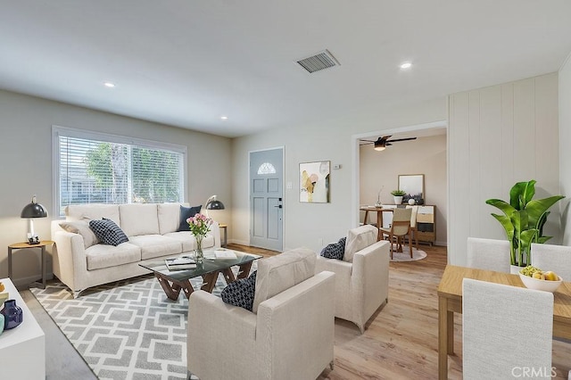 living area featuring recessed lighting, visible vents, ceiling fan, and light wood finished floors