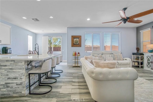 living room featuring ceiling fan