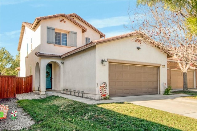 mediterranean / spanish-style house featuring a front lawn