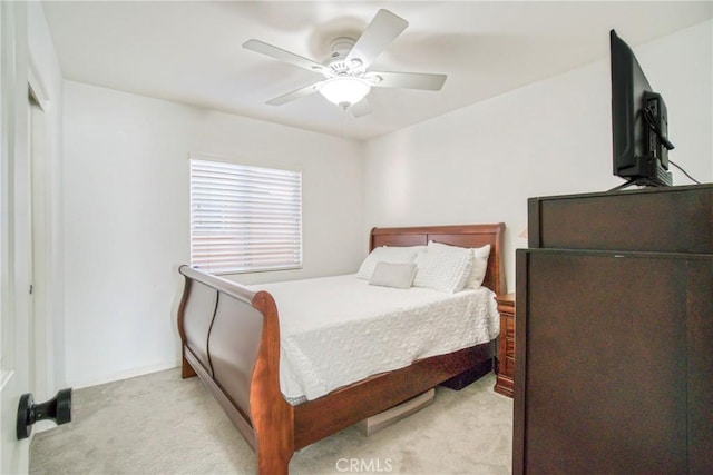 bedroom with light carpet and ceiling fan