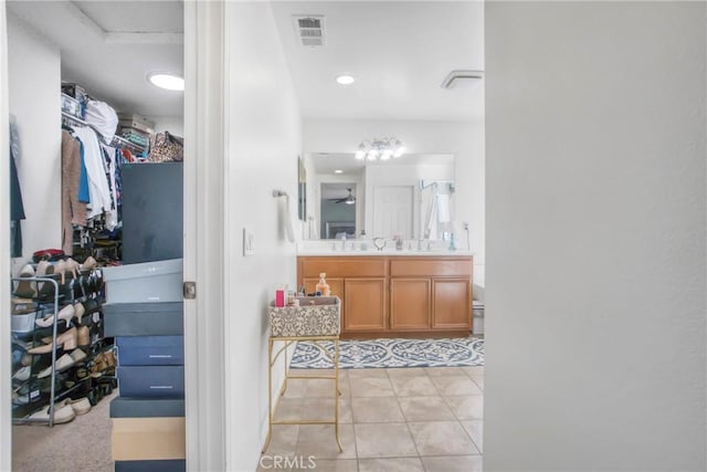 bathroom with tile patterned flooring and vanity