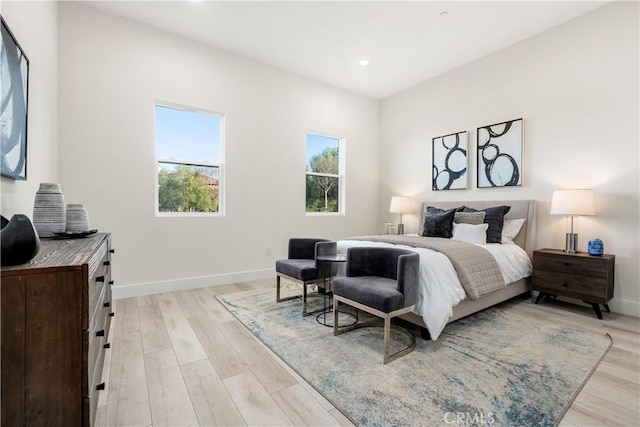 bedroom with light hardwood / wood-style floors