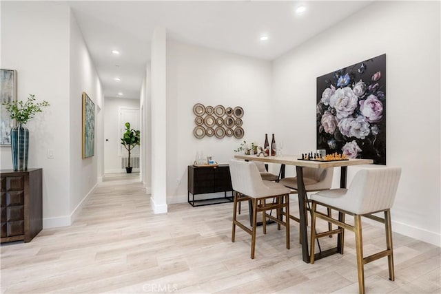 dining area with light hardwood / wood-style floors