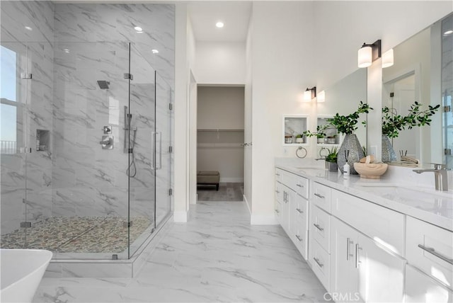 bathroom with vanity and independent shower and bath