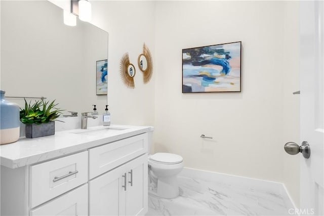 bathroom featuring toilet and vanity