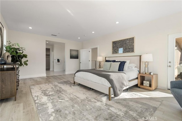 bedroom with light wood-type flooring