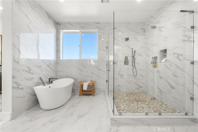 bathroom with shower with separate bathtub