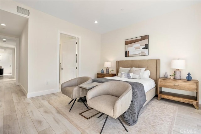 bedroom with light wood-type flooring