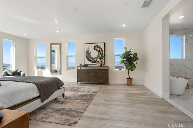 bedroom with light wood-type flooring